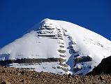 05 Mount Kailash South Face Close Up From Confluence Of Two Rivers Early Morning On Mount Kailash Inner Kora Nandi Parikrama Mount Kailash South Face shines in the early morning sun above an intervening ridge as we reach the confluence of the two dry rivers coming from both sides of Nandi (08:00).